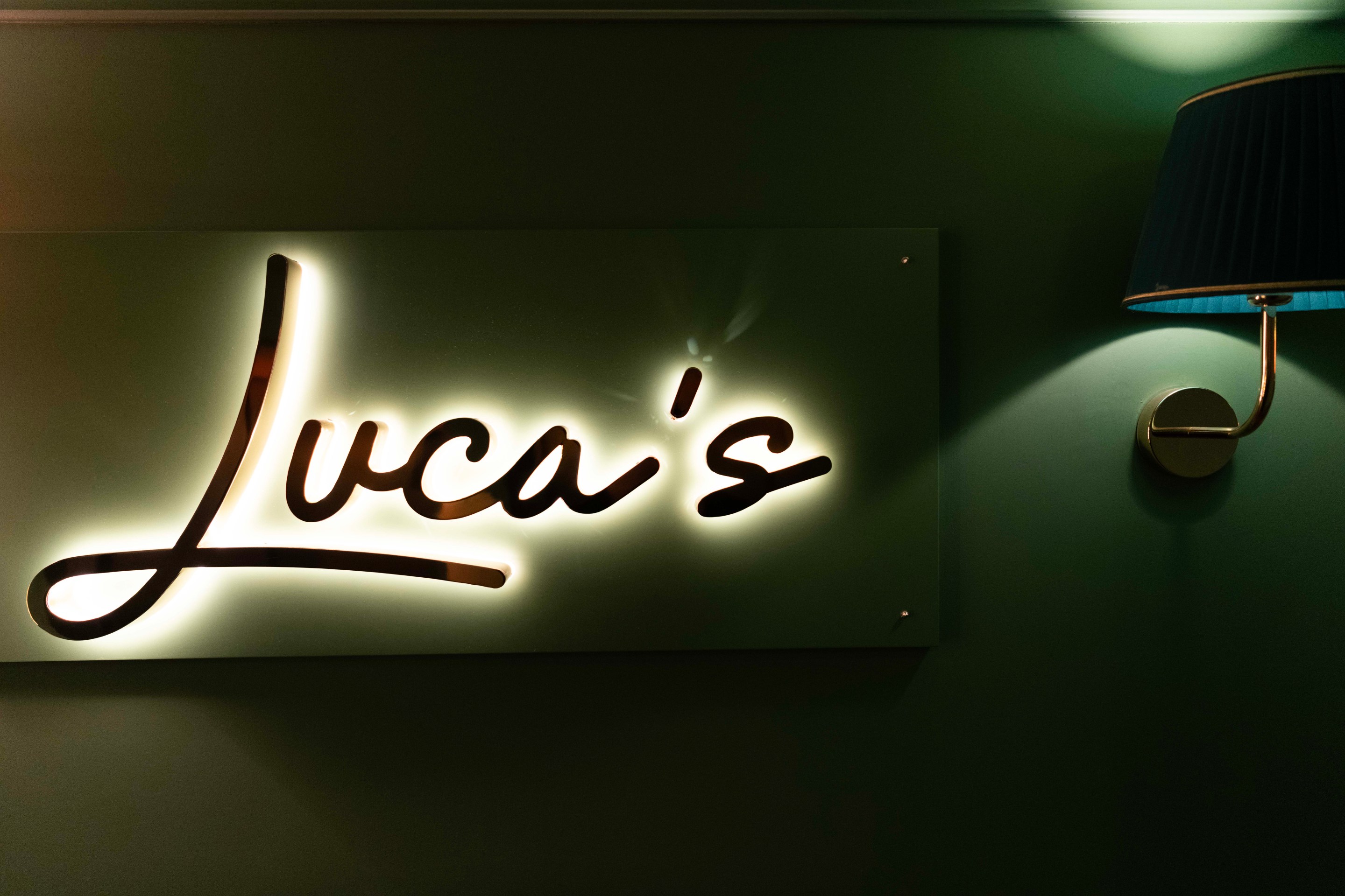Entrance sign to Luca's restaurant inside Hotel La Gemma in Florence.