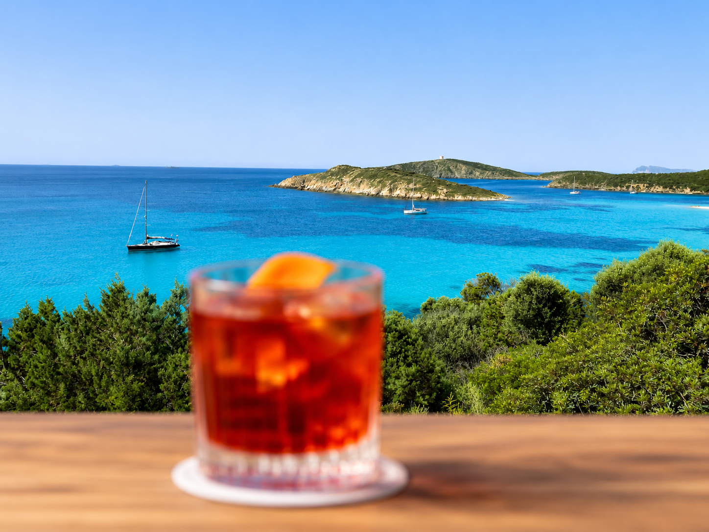 A Negroni overlooking Sardinia’s turquoise coastline,