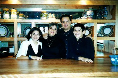 Early family photo of the Murdaca family behind the counter at Pietro's restaurant in Lodi, California.