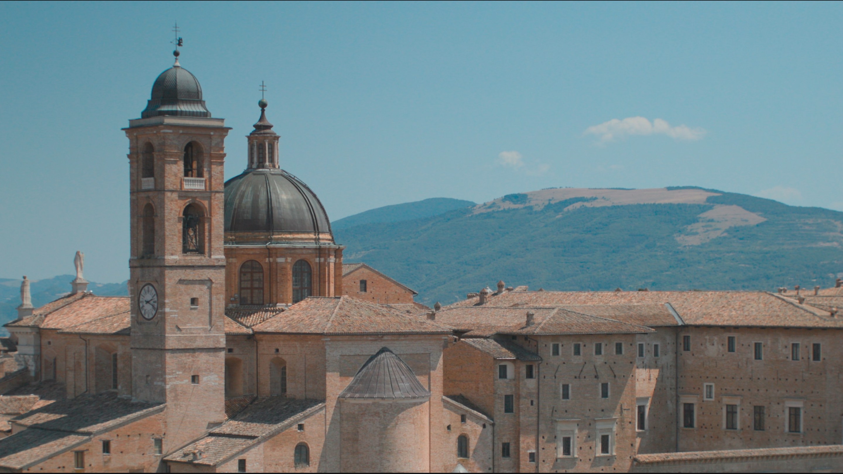 Aerial view of Urbino’s iconic Palazzo Ducale, with the rolling hills of the countryside in the background. (National Geographic)