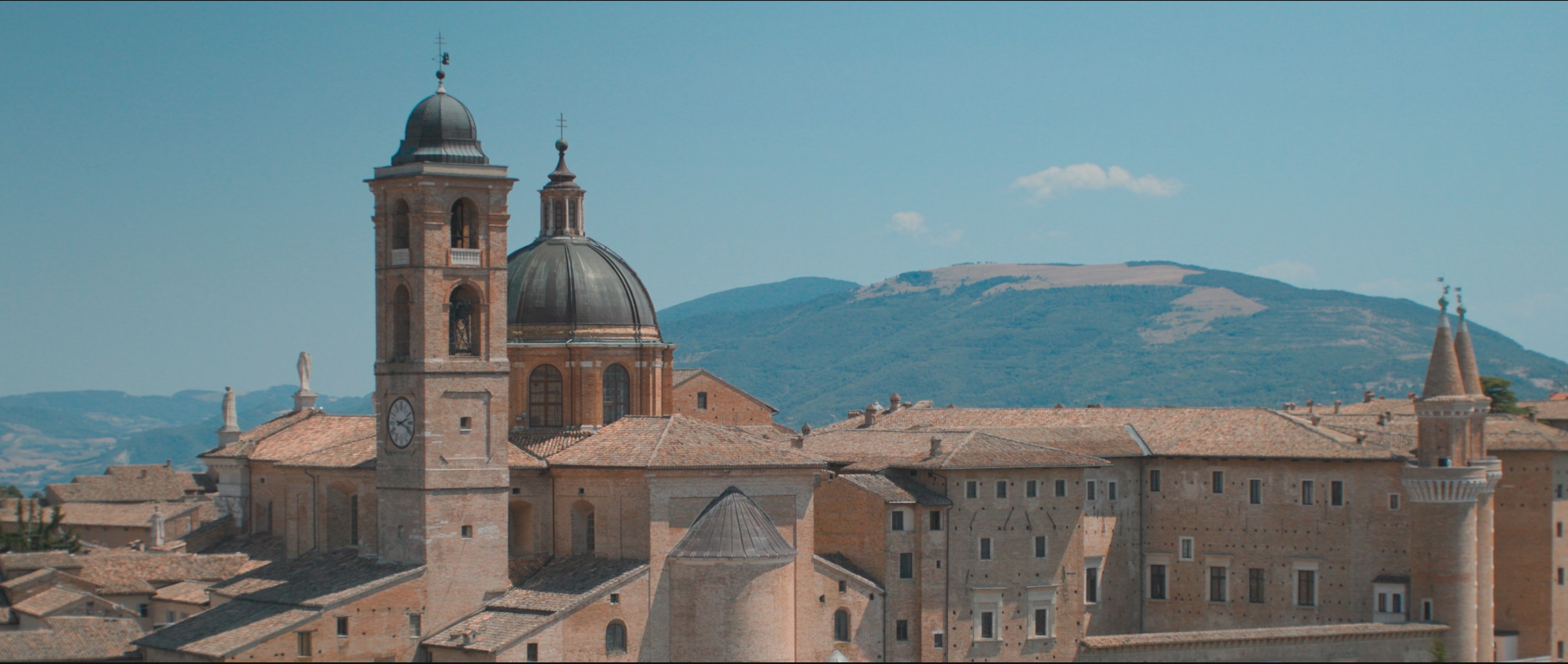 Aerial view of Urbino’s iconic Palazzo Ducale, with the rolling hills of the countryside in the background. (National Geographic)