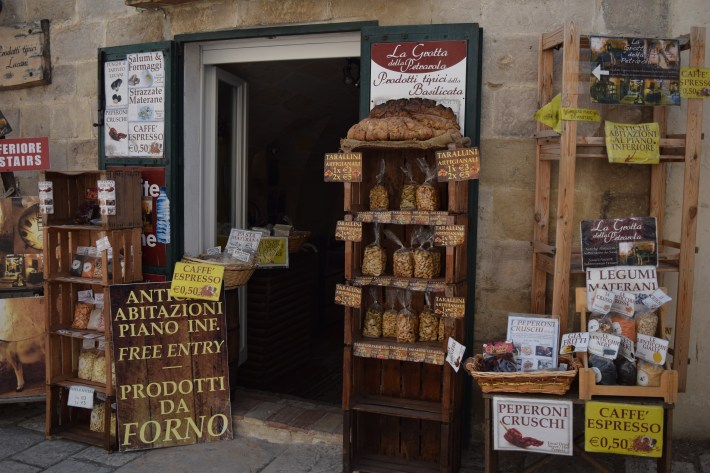 Shop in Matera displaying taralli, dried peppers, legumes and other local Basilicata foods.