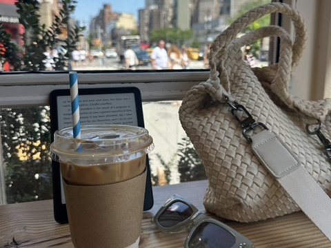 An iced coffee and a good book make for a leisurely summer afternoon.