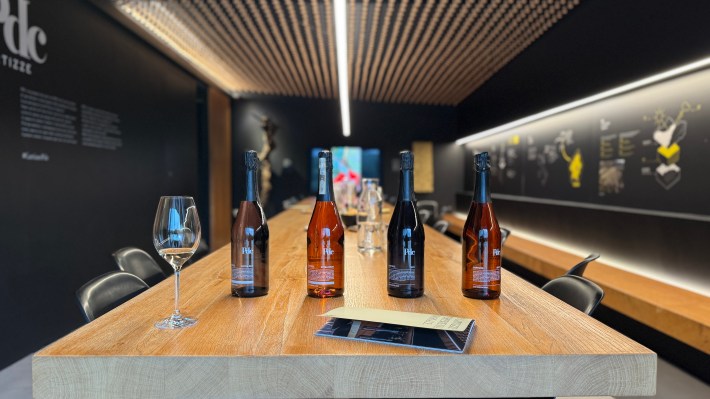Bottles of sparkling wine arranged for a tasting at Cartizze PDC