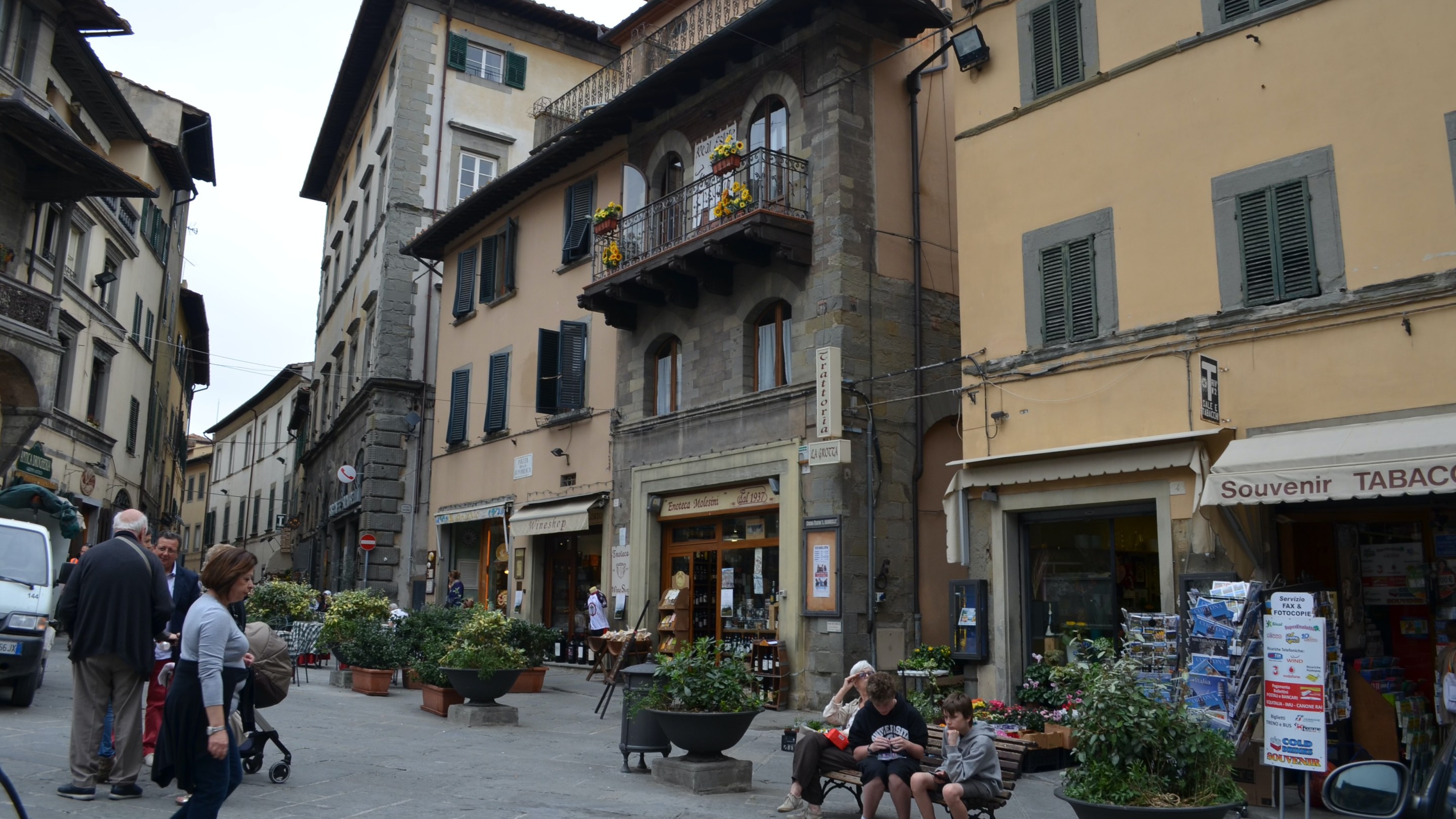 Street scene in Cortona, Tuscany, with shops and historic buildings