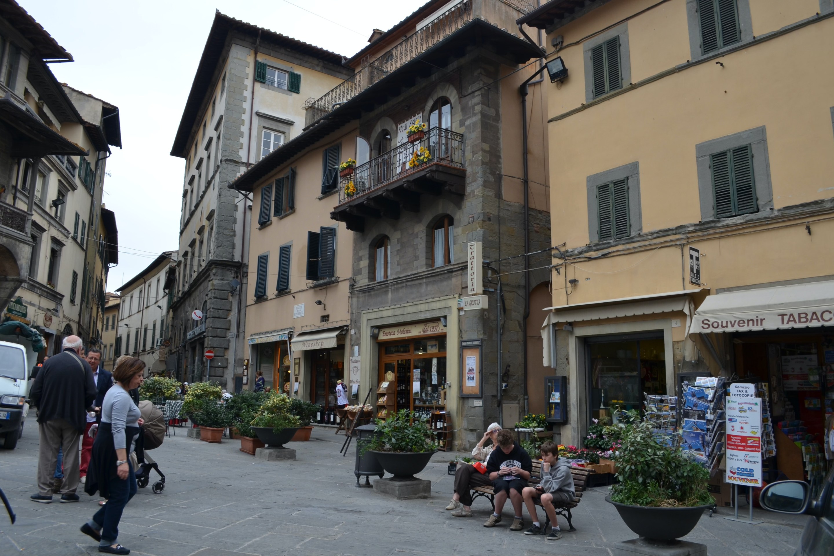Street scene in Cortona, Tuscany, with shops and historic buildings