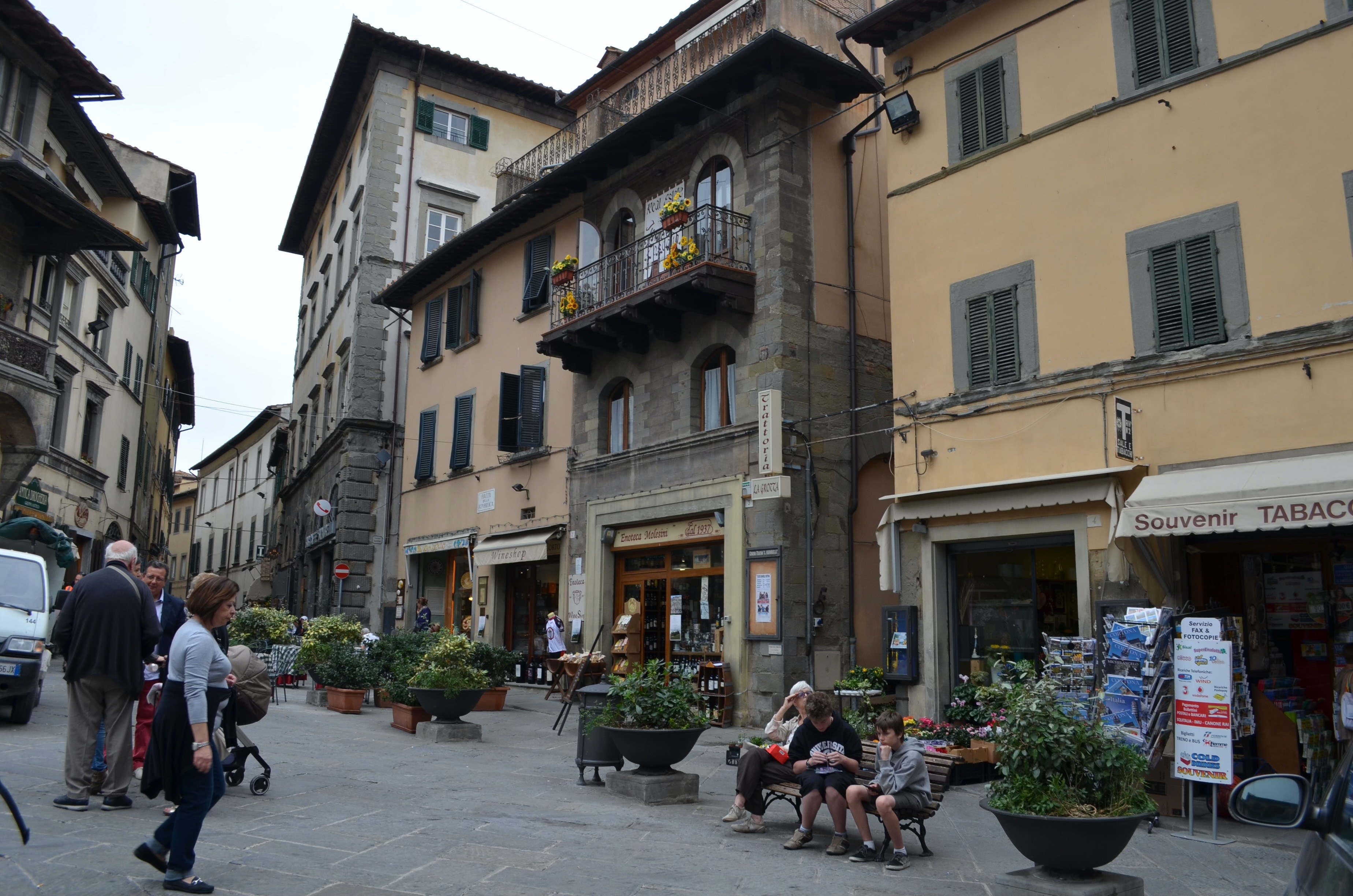 Street scene in Cortona, Tuscany, with shops and historic buildings