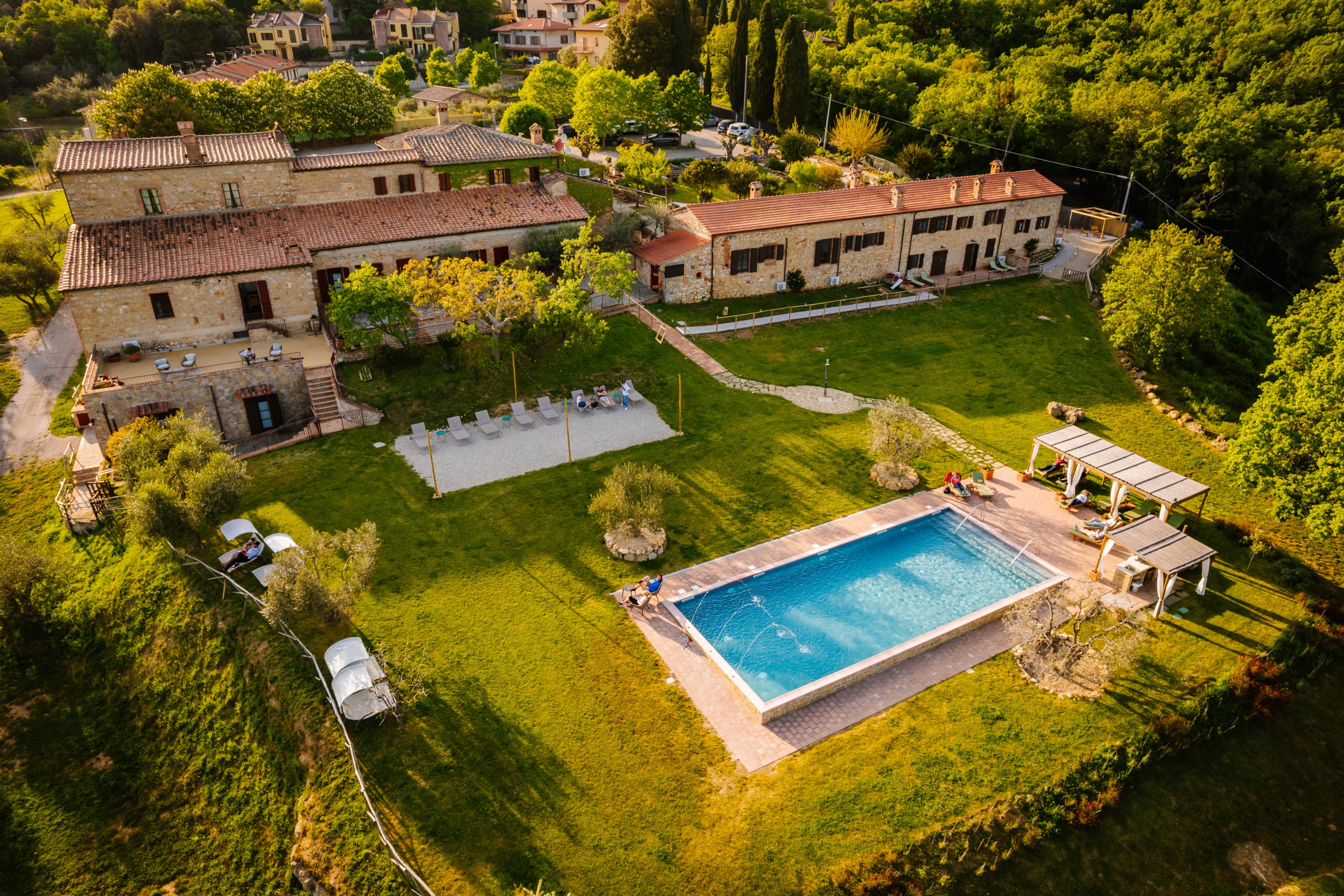 Aerial view of La Chiusa hotel and swimming pool in Tuscany