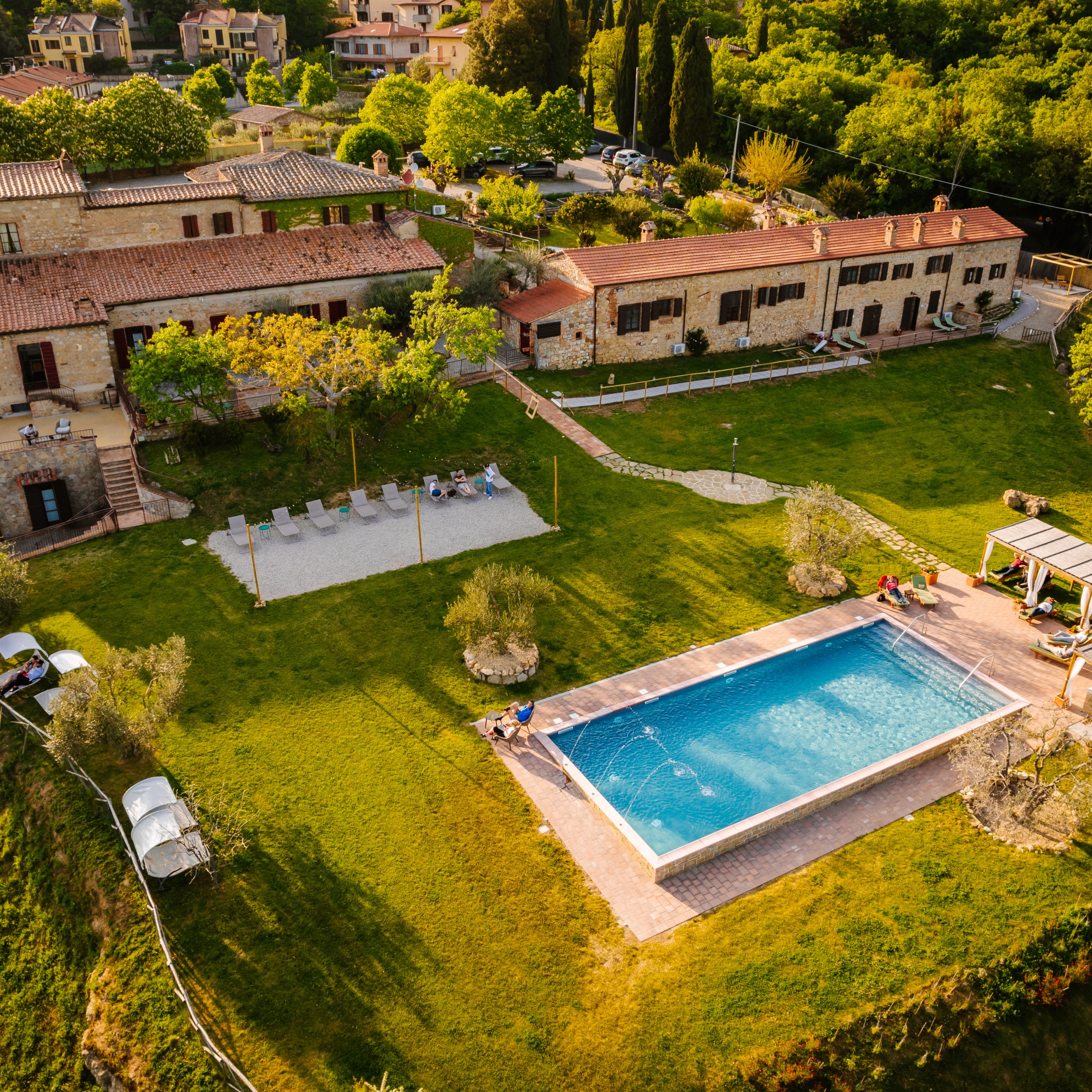 Aerial view of La Chiusa hotel and swimming pool in Tuscany