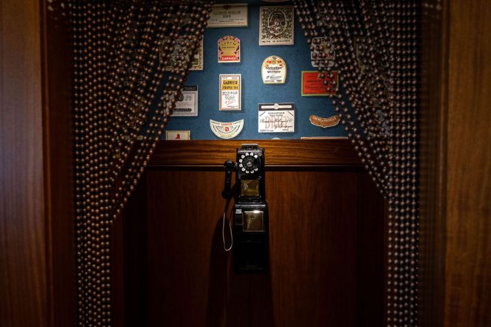 Vintage telephone and decorative wall display inside Jimmy's restaurant.