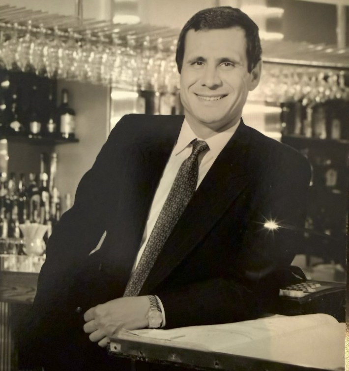 Young Lello Arpaia behind a restaurant bar