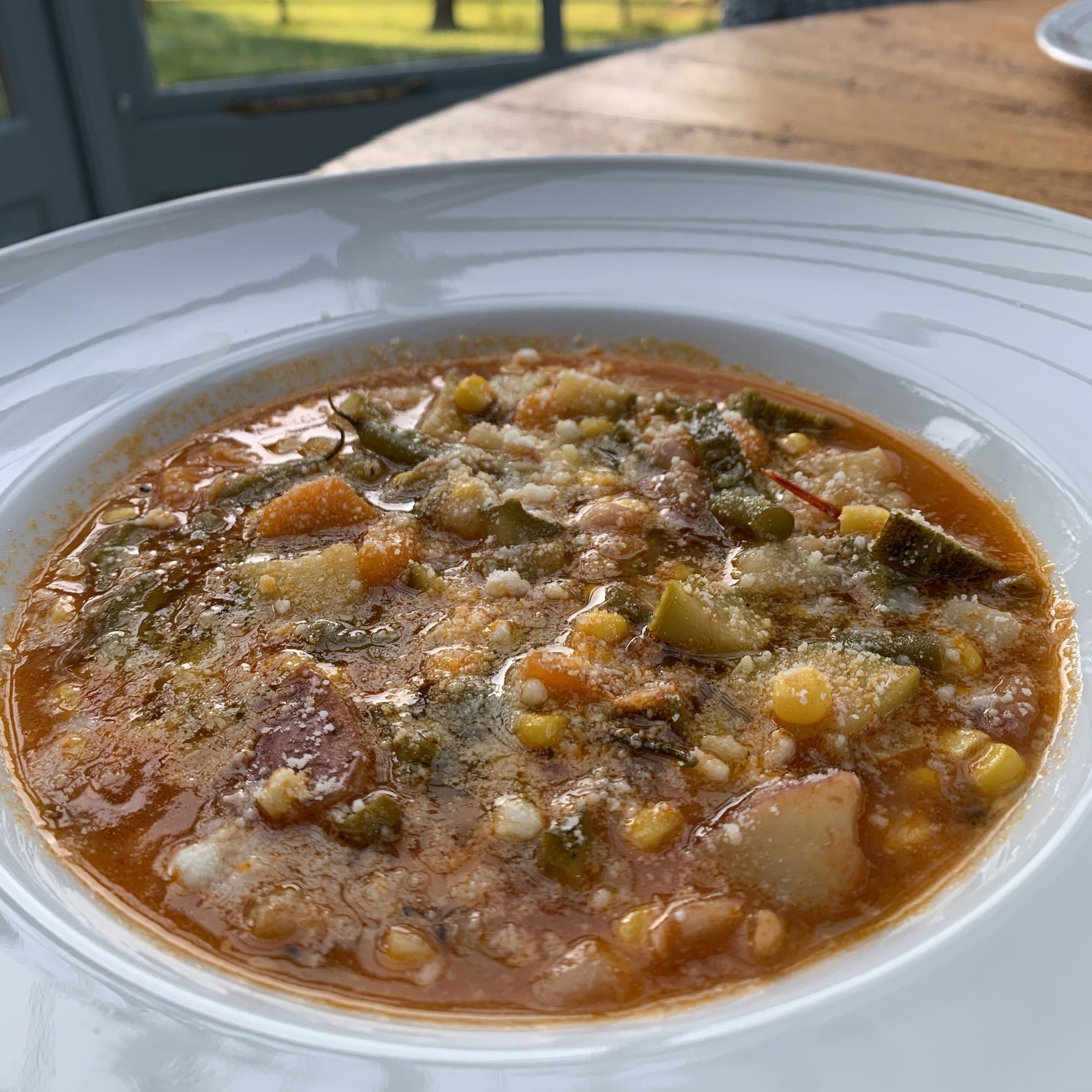 Nonna’s Italian summer vegetable soup with zucchini, corn, green beans, potatoes and cannellini beans.