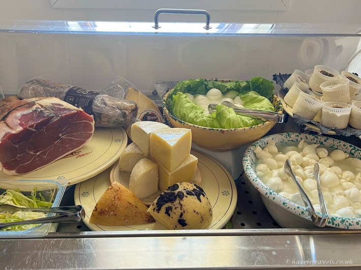 Photo 3: Local cheeses, fresh burrata and cured meats on display at Ristorante L'Aratro. Photo © Hazel’s Travel.