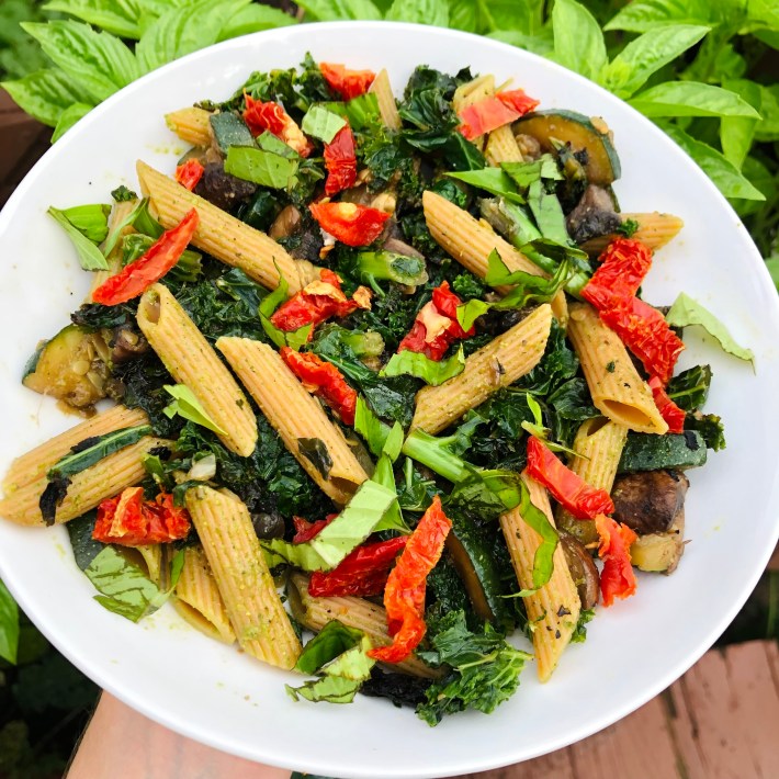 Penne with vegetables, sun-dried tomatoes and basil.