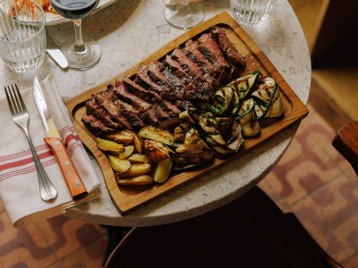 Steak with grilled vegetables at Storia in Miami.