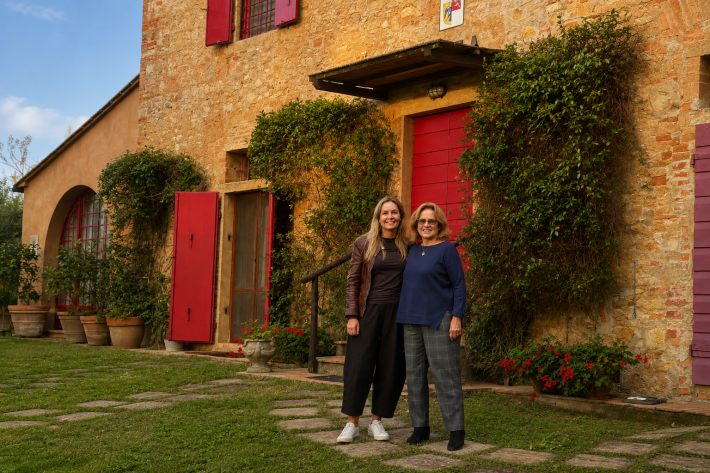 Jessica and Silvia outside the 19th-century farmhouse with traditional stone walls and red wooden doors and windows that appear in the company logo. Photo credit: Jessica Holloway