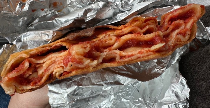 Sicilian scaccia filled with tomato sauce and folded into thin layers.