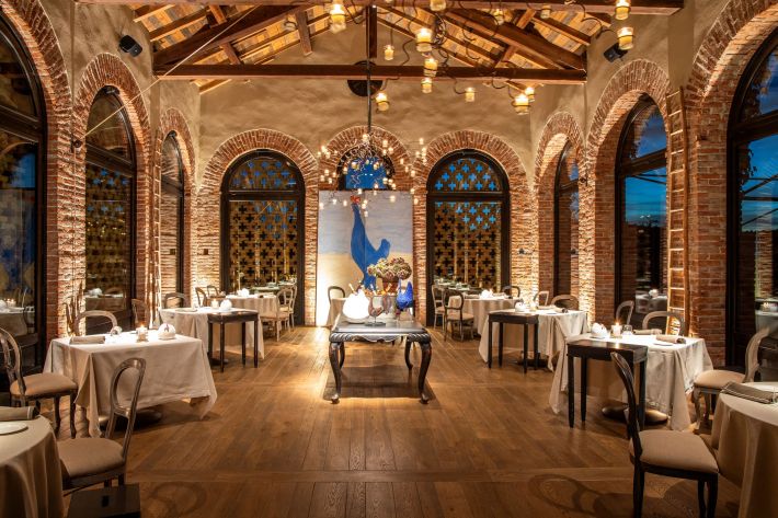 Elegant dining room at La Gallina restaurant at Villa Sparina.