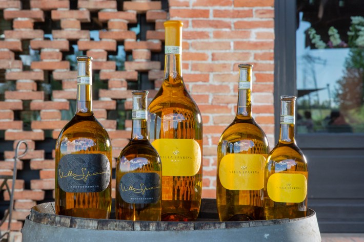 Villa Sparina Gavi wine bottles displayed outside the winery.
