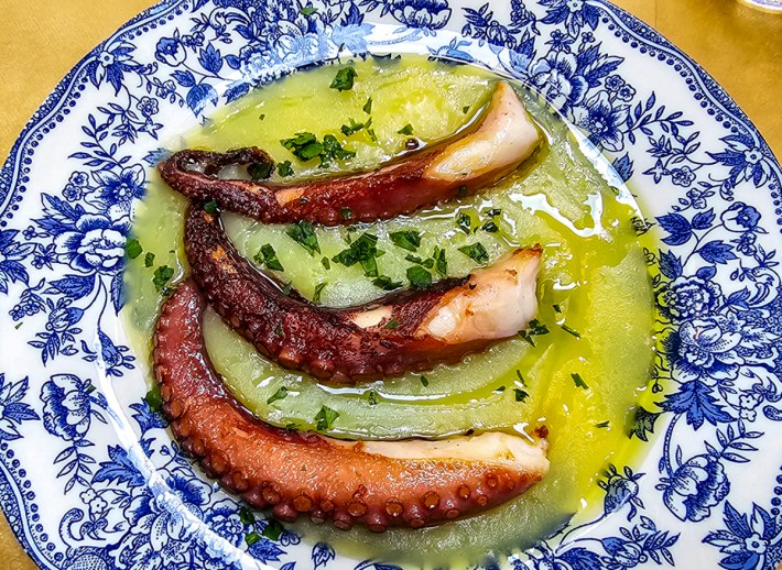 Octopus tentacle served over potato cream at Trattoria ’nta Nonna.