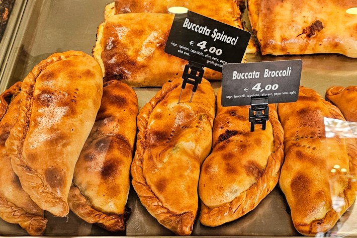 Meat pies displayed in the deli case at Trattoria ’nta Nonna.
