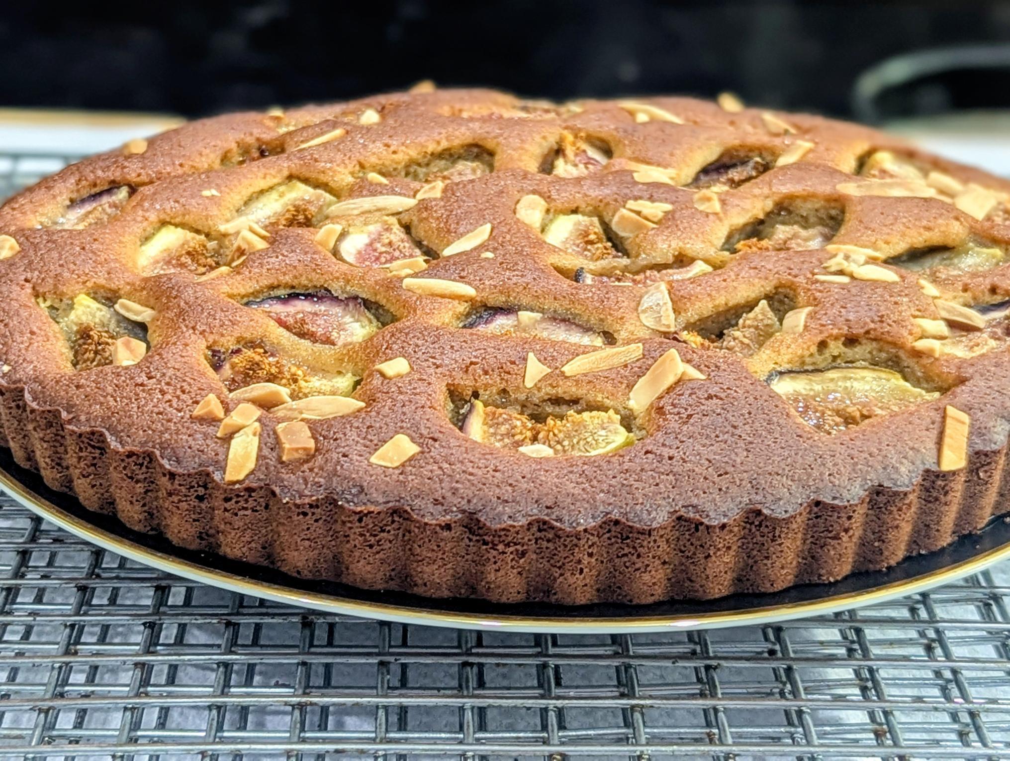 Whole fig olive oil cake with fresh figs and sliced almonds baked into the top