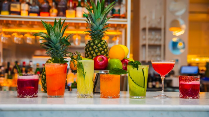 Colorful cocktails displayed across the bar at Ginger Ristorante in Midtown Manhattan.