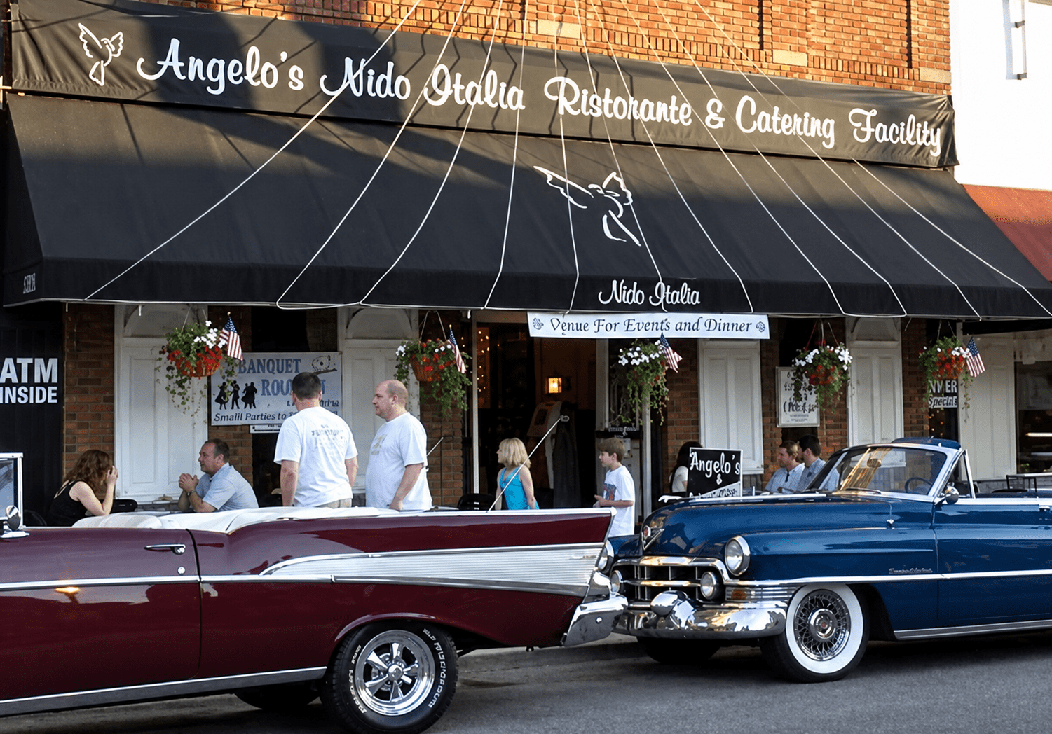 Classic cars parked outside Angelo’s Nido Italia in Cleveland’s Little Italy. Courtesy of Angelo’s Nido Italia.