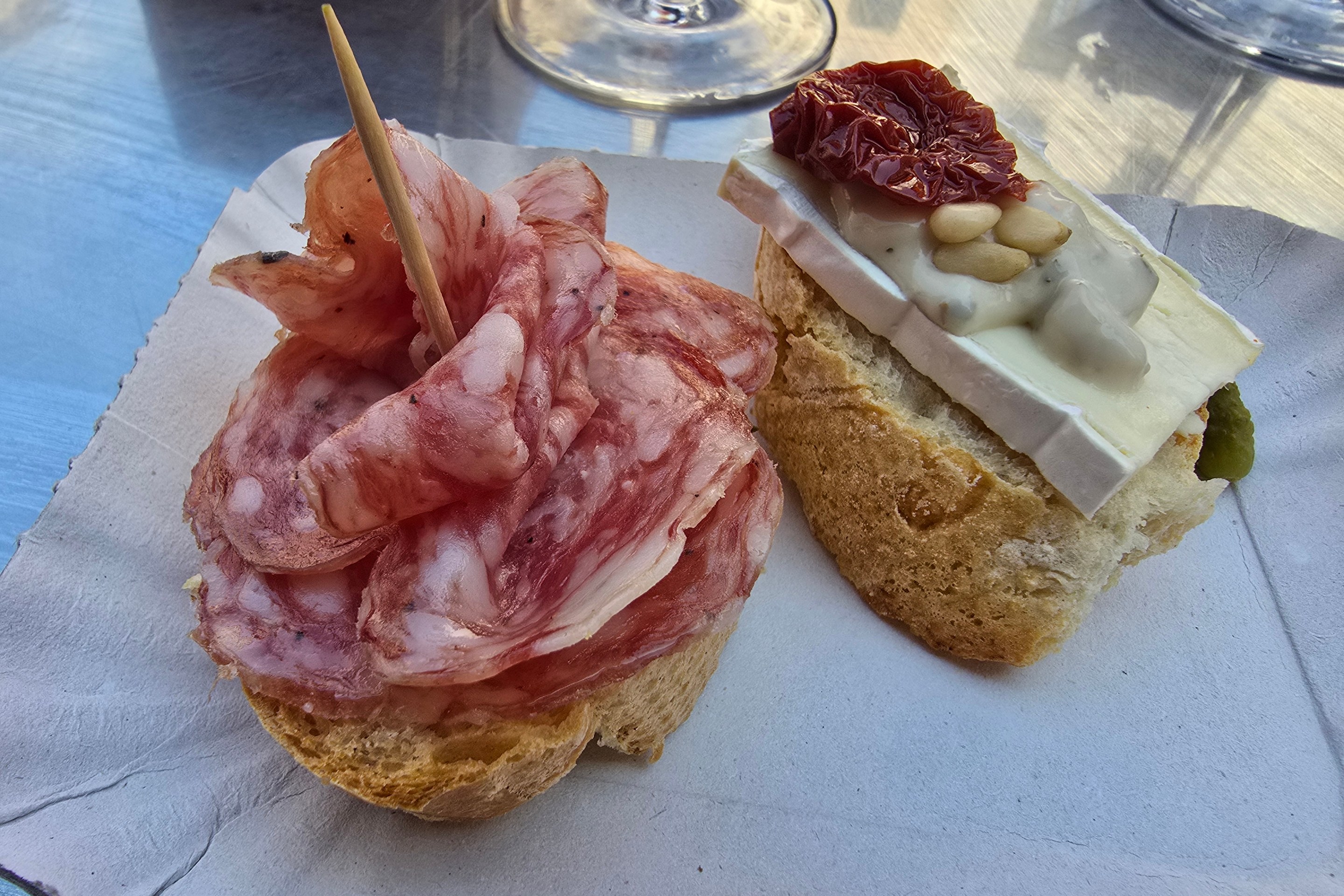 Sliced cured meat served on bread.