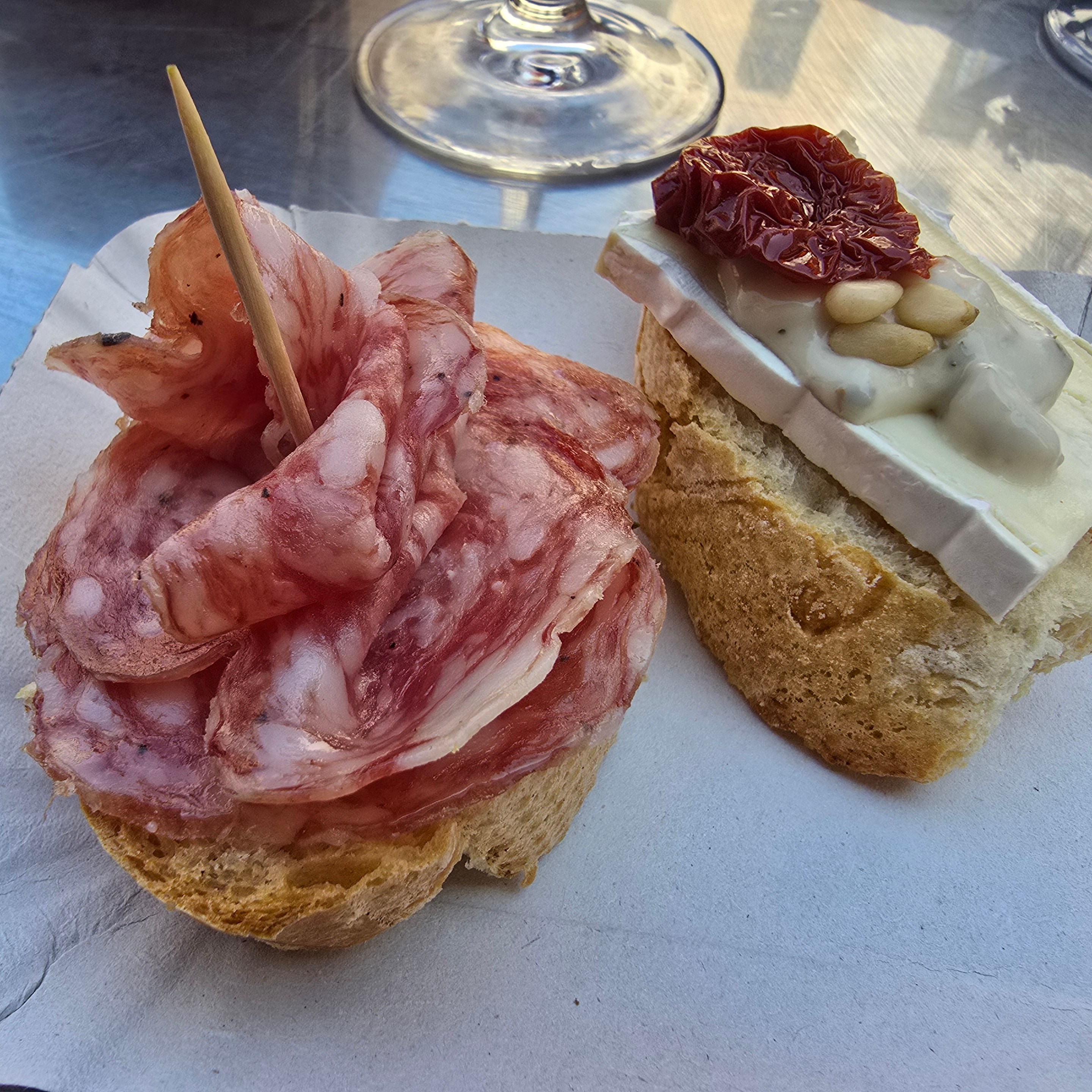 Sliced cured meat served on bread.