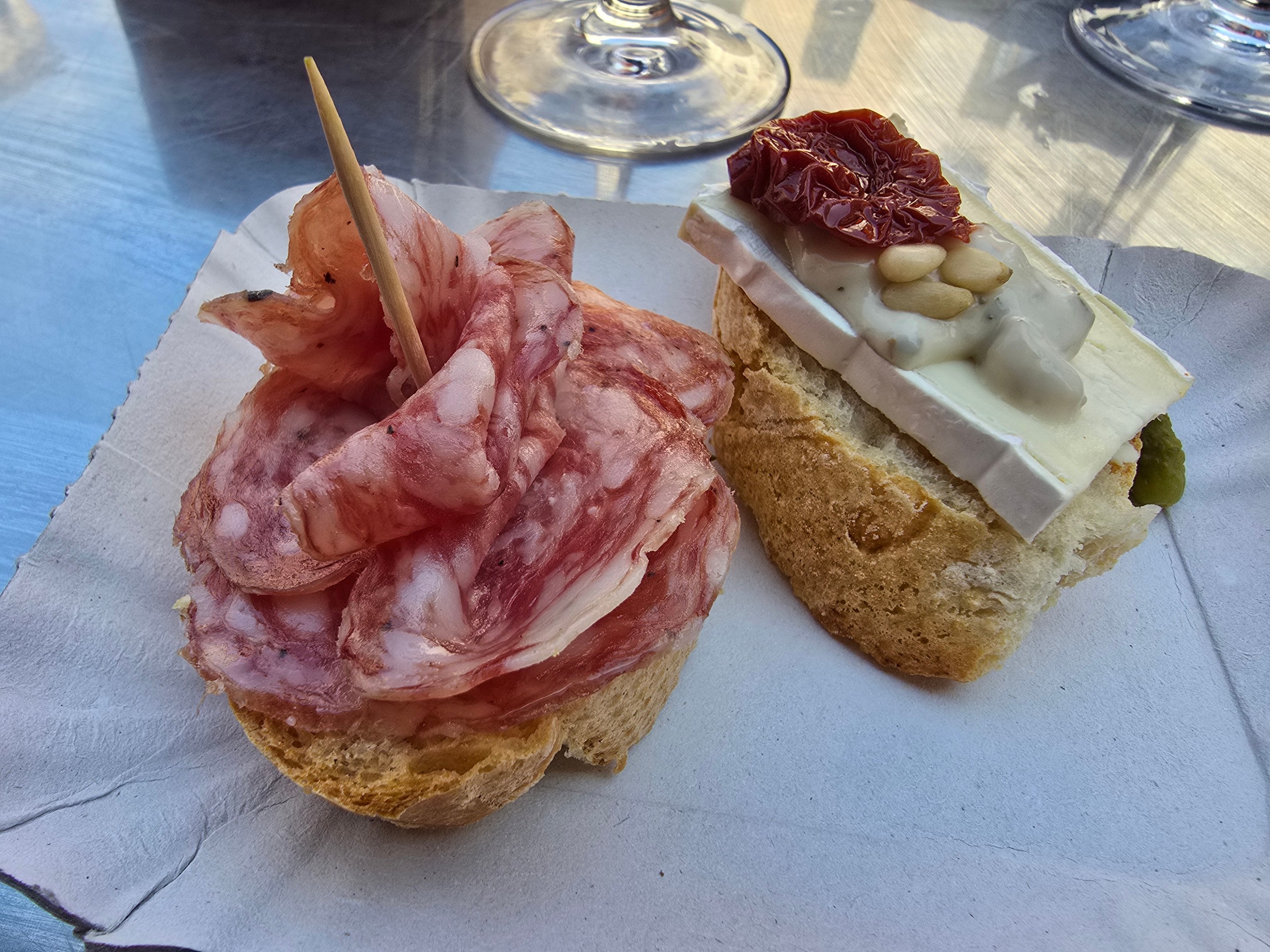 Sliced cured meat served on bread.