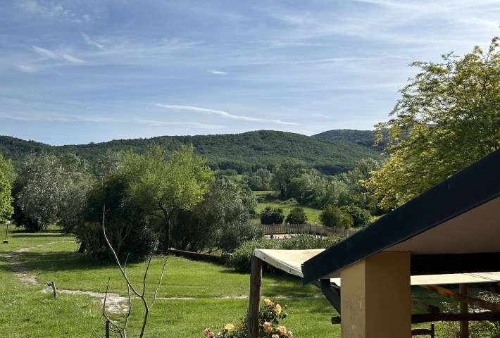 Green hills surround Agriturismo Santa Lorica in Tuscany. Photo by Monique Evdokiou.
