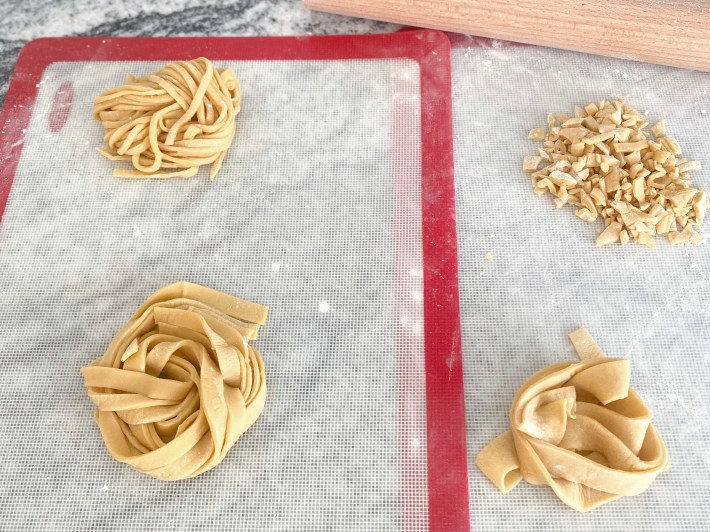 Homemade pasta on baking sheets