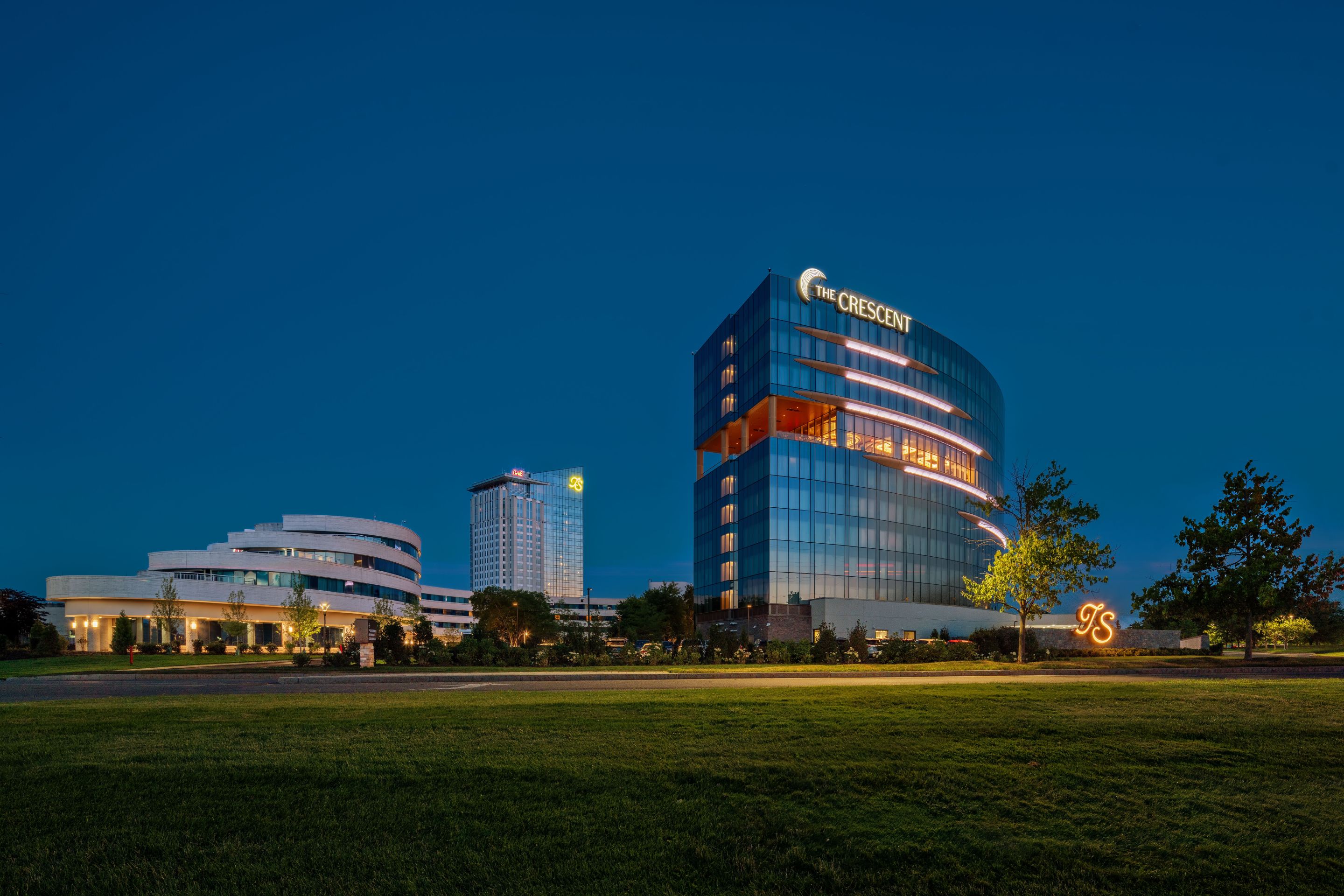 Turning Stone Resort Casino and The Crescent illuminated at night in Central New York