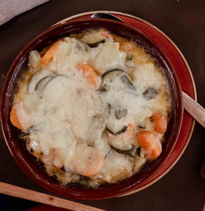 Melted Fontina adds richness to a traditional vegetable soup. Photo by Inbal Cabiri.