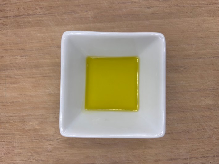 Extra-virgin olive oil in a white bowl