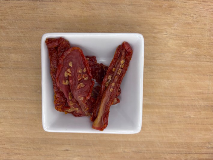 Sun-dried tomatoes in a white bowl