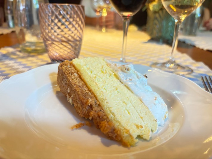 Slice of limoncello-meringue cheesecake on a plate