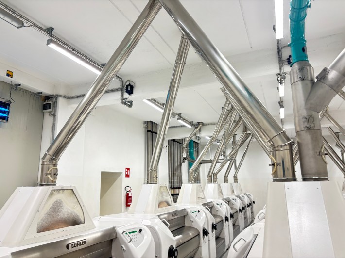 Milling equipment and metal pipes inside Molino Dallagiovanna