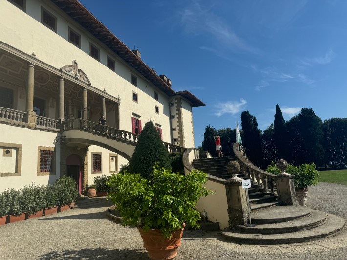 Curved stone staircase and columned entrance at Villa Medici La Ferdinanda